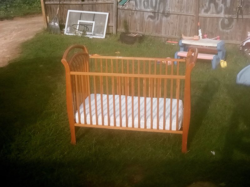 A wooden baby crib refinished by Jason of all Trades